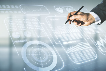 Poster - Man hand with pen working with abstract virtual analytics data spreadsheet on blurred office background, analytics and analysis concept. Multiexposure