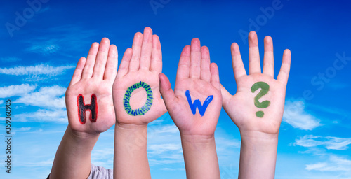 Children Hands Building Colorful English Word How. Blue Sky As Background