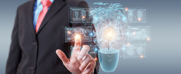 Fototapete - Man holding and touching holographic projection of a plant with digital analysis 3D rendering
