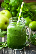 Fresh Healthy Green  Smoothie In Glass Mason Jar With Straw