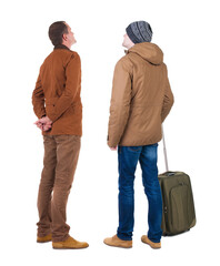 Poster - Back view of two man in winter jacket traveling with suitcas.