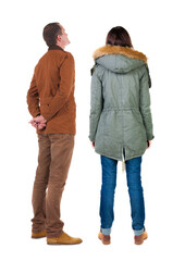 Poster - Back view of couple in winter jacket.