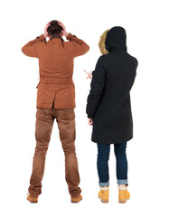 Sticker - Back view of two pointing girl in winter jacket.