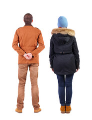 Sticker - Back view of couple in winter jacket.