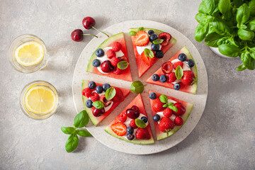 Wall Mural - watermelon pizza slices with yogurt and berries, summer dessert