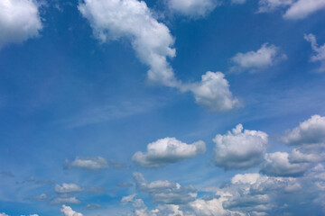 White clouds on blue sky background.