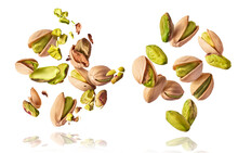 A Set With Flying In Air Fresh Raw Whole And Cracked Pistachios  Isolated On White Background. Concept Of Pistachios Is Torn To Pieces Close-up. High Resolution Image