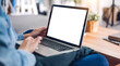 © Art_Photo - Young creative woman relaxing using laptop computer working and typing on keyboard with white mockup blank screens at home