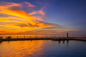 Wall Mural - Amazing sunset reflected in the water, Thailand