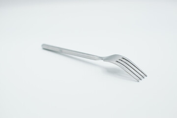 stainless fork on white background