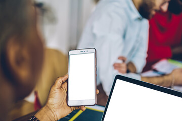Poster - selective focus on modern smartphone device with copy space display in woman's hands.cropped view of