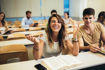 Sticker - University students studying together in classroom.