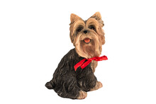 Ceramic Dog Figurine With A Red Bow On A White Background, Isolated