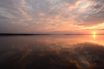 Wall Mural - Sunlight and shades of a beautiful sunset in summer silence evening