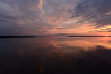 Wall Mural - Amazing sunset colors on the lake in the calmness weather in a summer evening