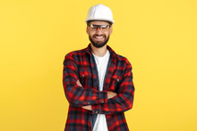 Attractive Bearded Engineer Or Constructor Man In Plai Shirt Standing Over Yellow Background. Looking In Camera.