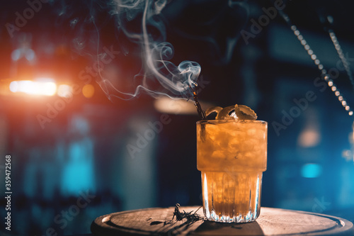 Cuadros en Lienzo scottish bee cocktail with smoke on blue background