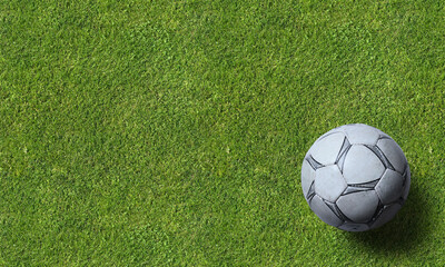 Soccer ball and equipment on grass background