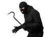 © Prostock-studio - Thief wearing black mask and hoodie looking angrily at camera