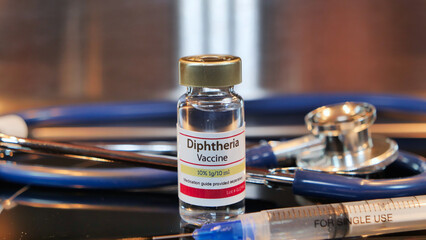 Vial of Diphtheria vaccine with stethoscope and syringe