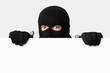 © Prostock-studio - Masked villain peeking out white blank board