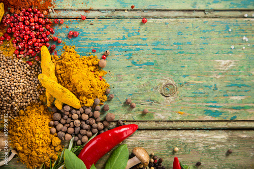Various colorful spices on wooden table, top view. Canvas Print