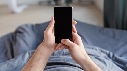Aufkleber - Guy Using Phone Lying In Bed At Home, Mockup, POV