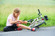 © Petr Bonek - Sad crying little child girl fell from the bike in the summer park. Bleeding on hands and feet. Bicycle accident. Injuries while cycling. Accidents and injuries to children during summer activities
