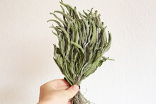 Dried Bunch Of Sage Herbs On Wooden Background. Traditional Medicine. Relax Spa Settings.