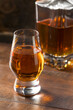 © Brent Hofacker - Boozy Amber Whiskey in a Snifter