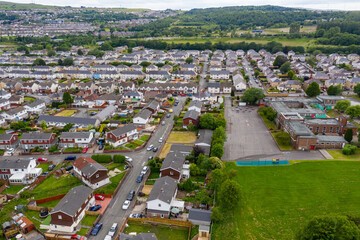Wall Mural - Aerial drone view of a residential area of a small Welsh town surrounded by hills (Ebbw Vale, South Wales, UK)