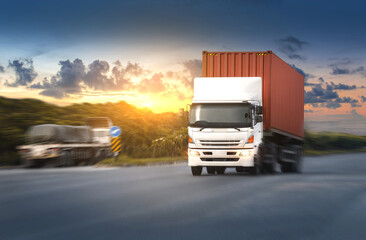 Container truck on the highway at sunset sky background.