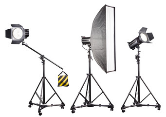 Photo studio lighting stands with flash and softbox isolated on the white.