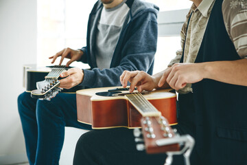 Wall Mural - Learning to play the guitar