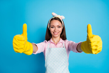 Portrait of her she nice attractive lovely cheerful cheery glad girl washer maid giving two double thumbup advert cool tidy neat isolated over bright vivid shine vibrant blue color background