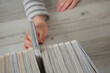 © Kana Design Image - A Child choosing a book.  本を選ぶ子供