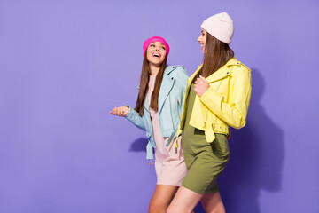 Wall Mural - Portrait of nice attractive lovely pretty friendly cheerful cheery girls pals discussing news strolling isolated over bright vivid shine vibrant violet lilac purple color background