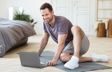Aufkleber - Man Turning On Laptop For Online Fitness Workout At Home