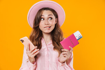 Poster - Image of confused woman holding passport with ticket and mobile phone