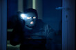 © Prostock-studio - Intruder breaking in apartment or office using flash light