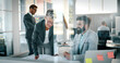 © NDABCREATIVITY - Picture of businessman and businesswoman talking in office