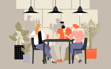 A group of friends spends time at a table in a cafe, drinking cocktails and chatting