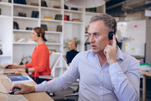 Caucasian Businessman Working With Headset