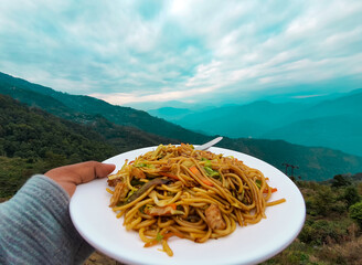 North Indian Vegetable chow mein with the mountains in the background in Darjeeling,India