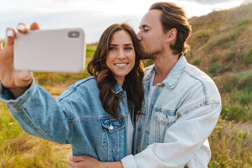 Wall Mural - Beautiful happy young couple in love spending time together