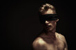 naked guy with blindfold