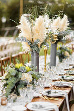 Wedding Table Set Up In Boho Style With Pampas Grass And Greenery