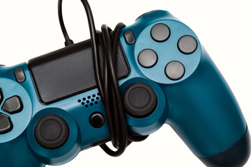 Game controller with a coiled USB cable close up on a white background