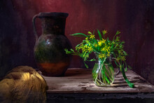 Classic Still Life With Bouquet Of Spring Yellow Flowers Gagea, Old Vintage Jug And Yellow Drapery In A Ray Of Light On Brown Background . Art Photography.
