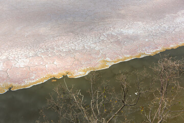  Aerial view of the salt pan and mineral crust with red algae of Lake Magadi, in the Great Rift Valley, on the border between Kenya and Tanzania. The Rift Valley contains a chain of active volcanoes.